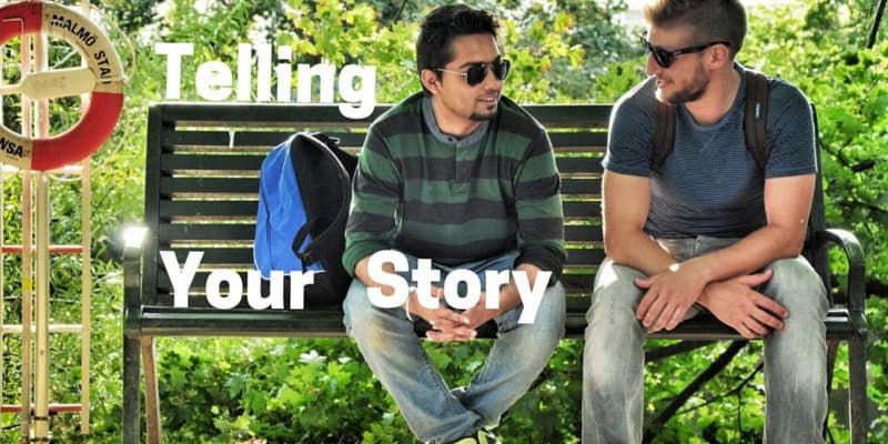 Two young men sitting on a park bench talking to each other, telling a story with graphics.