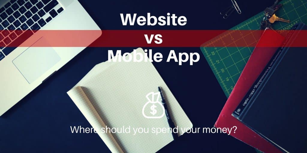 Website vs Mobile App: Where should you spend your money? Laptop sitting on a table with graph paper also.